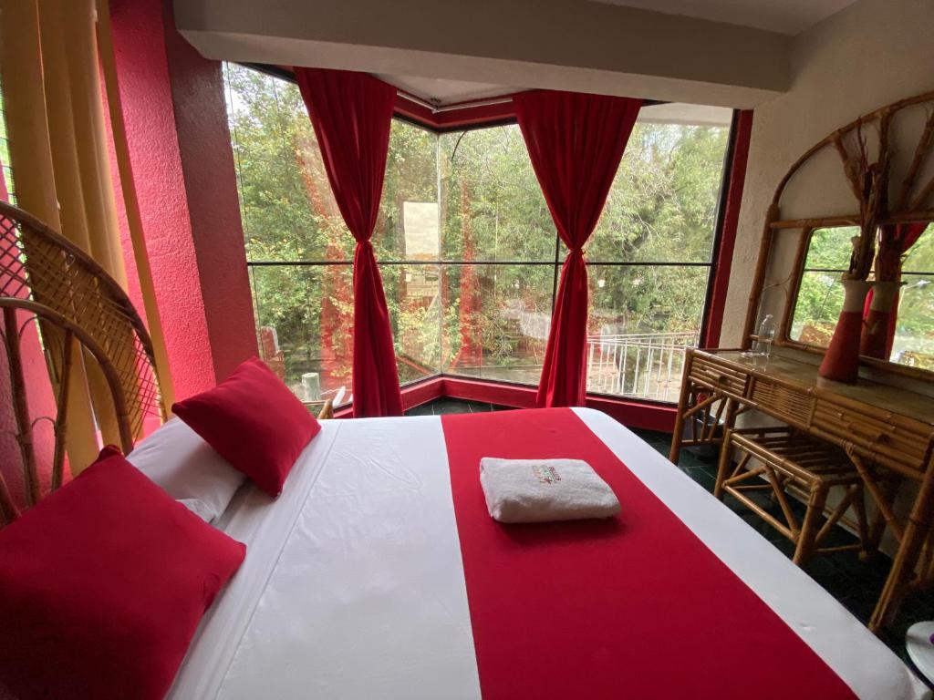 Postel nebo postele na pokoji v ubytování Hotel Alameda