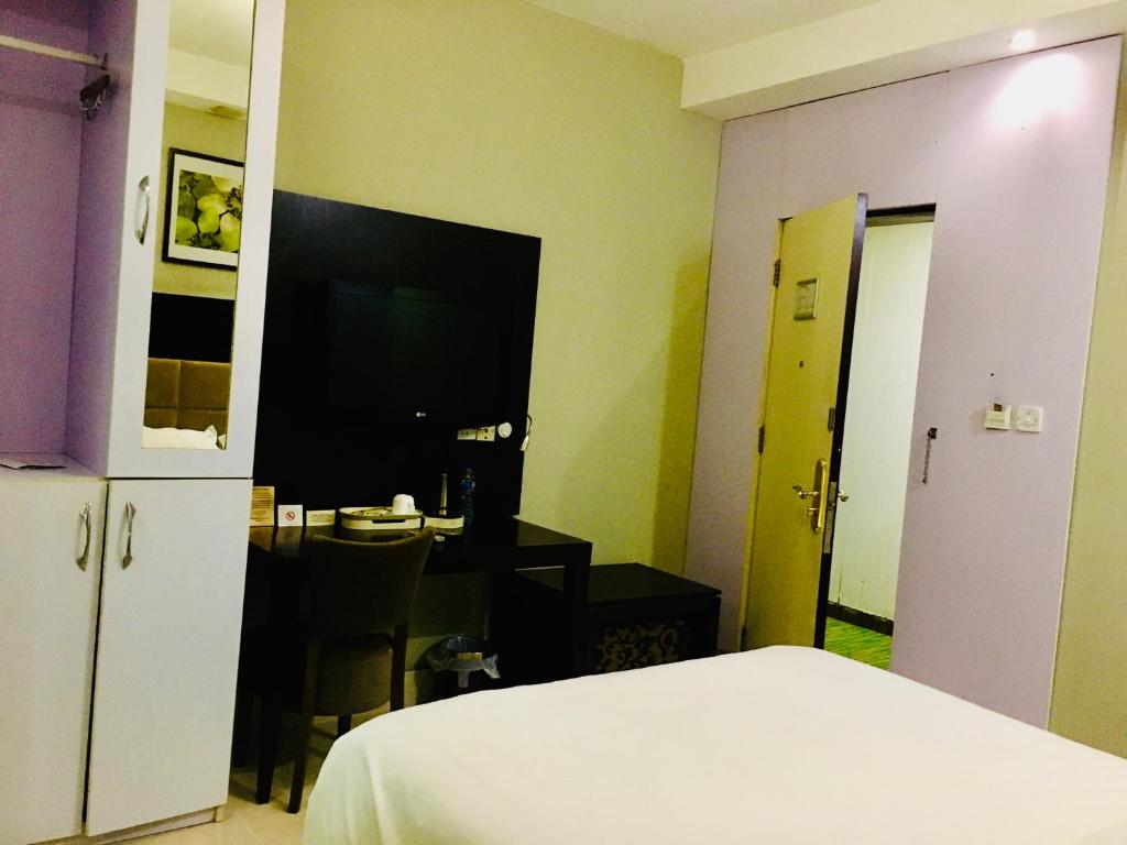 Postel nebo postele na pokoji v ubytování BW Starfire Hotel