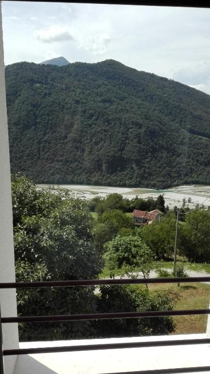 a view from a window of a river and a mountain at Agriturismo Saettà in Lentiai
