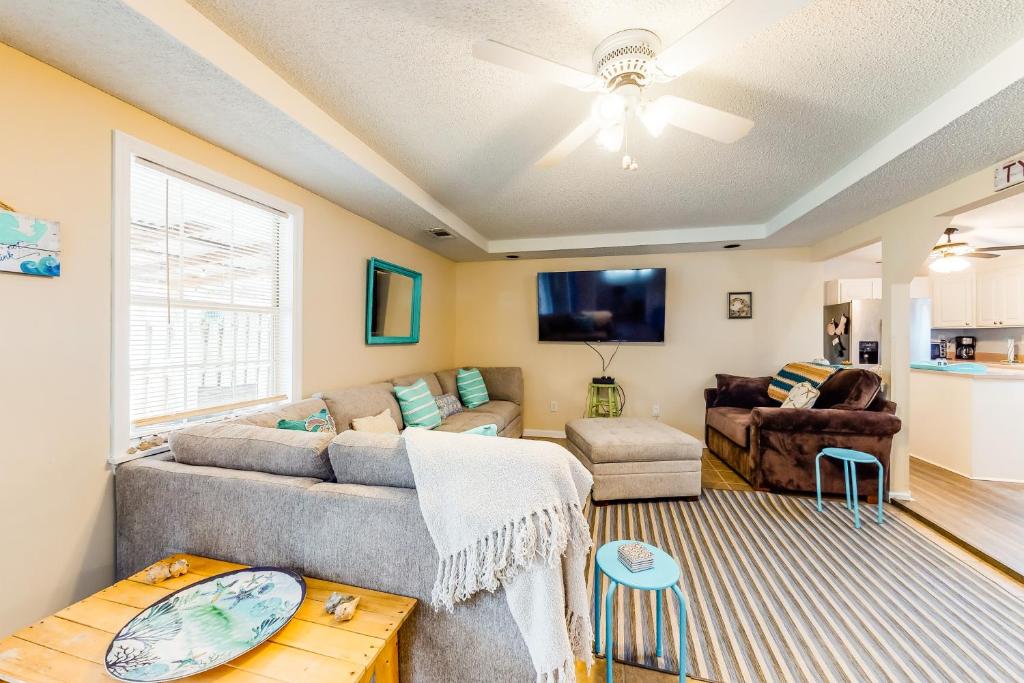 a living room with a couch and a table at Tybee Southern Comfort in Tybee Island