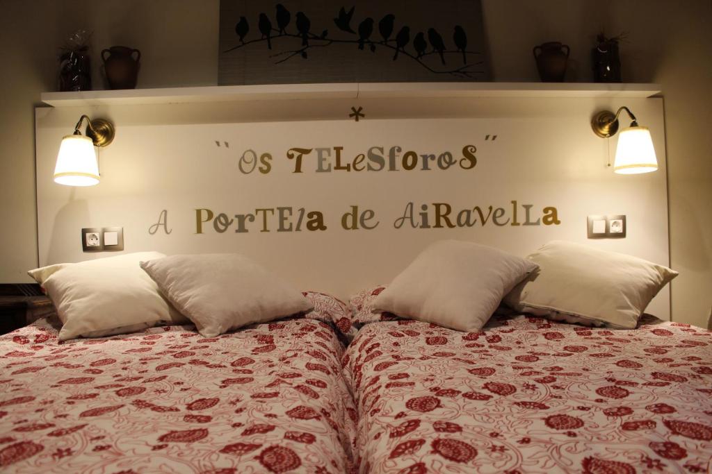 a bedroom with a bed with a sign on the wall at Apartamento Rural "Os Telesforos" in Allariz