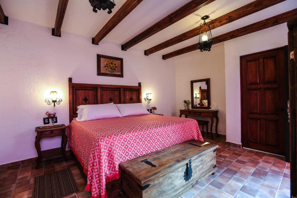 Postel nebo postele na pokoji v ubytování El mesón del Quijote