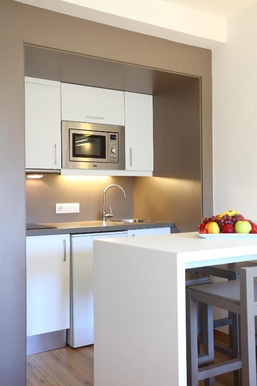 Kuchyň nebo kuchyňský kout v ubytování Apartamentos Jade - Adults Only
