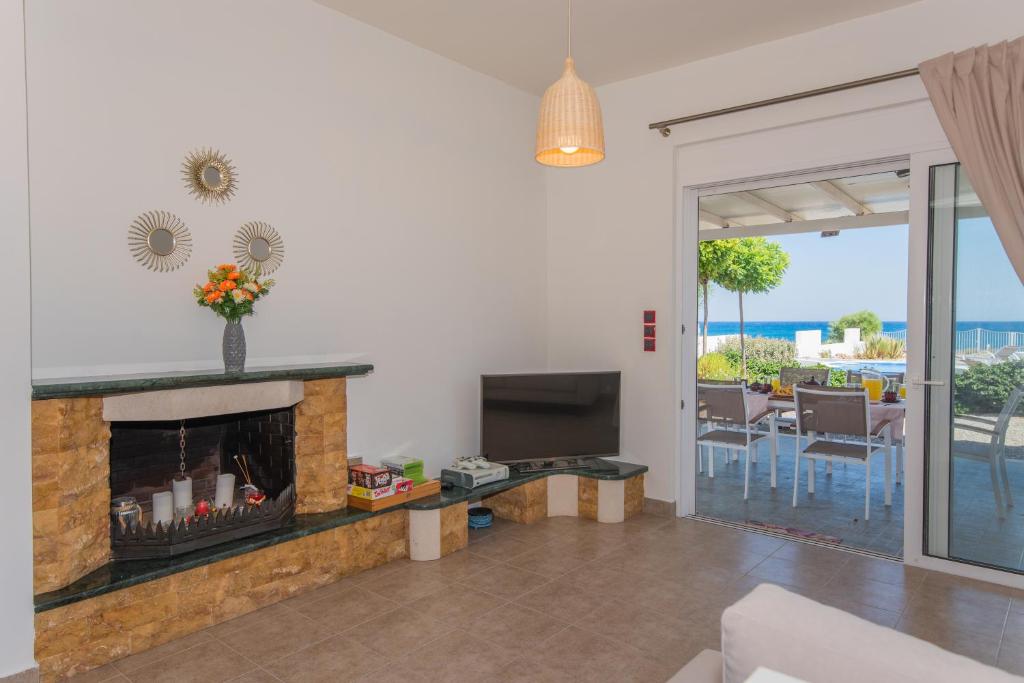 Posezení v ubytování Aegiali Sea View Villa