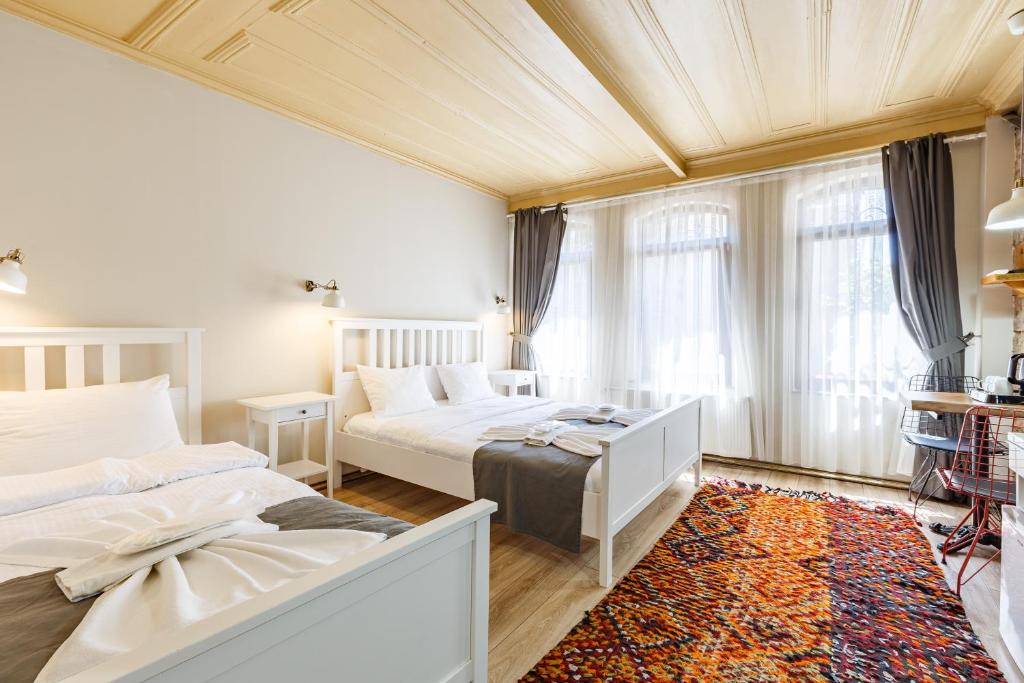 Postel nebo postele na pokoji v ubytování Hotel Miro Mansion Old City