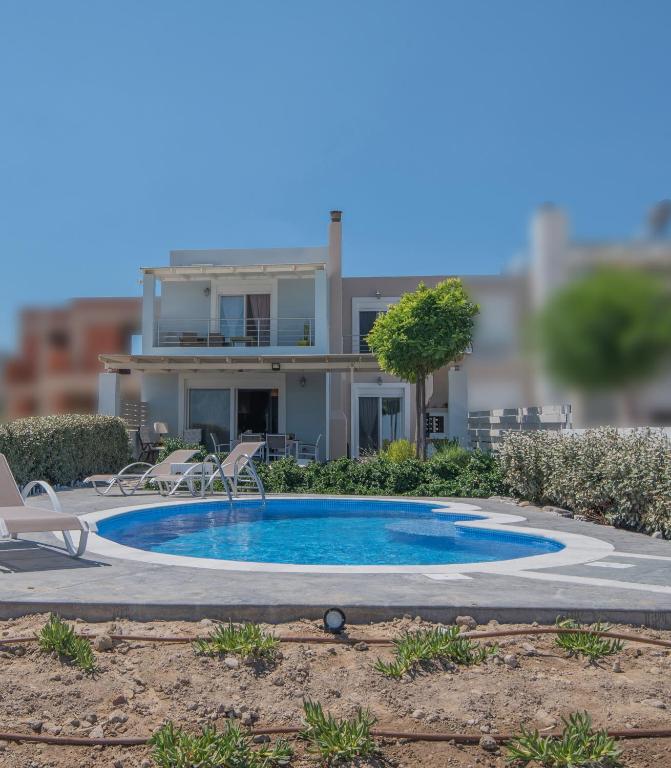Bazén v ubytování Aegiali Sea View Villa nebo v jeho okolí