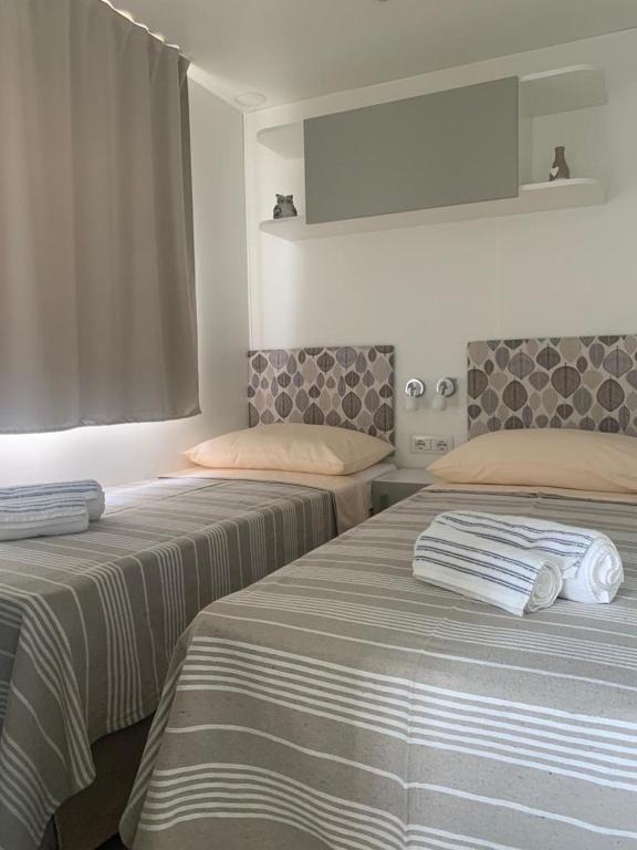 Postel nebo postele na pokoji v ubytování Mobile home Istra BI VILLAGE