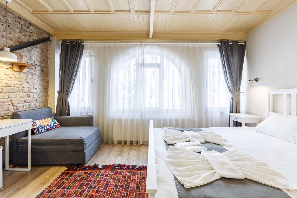Postel nebo postele na pokoji v ubytování Hotel Miro Mansion Old City