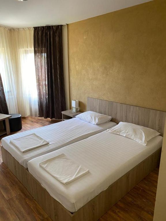 Postel nebo postele na pokoji v ubytování Pensiunea Casa Soarelui