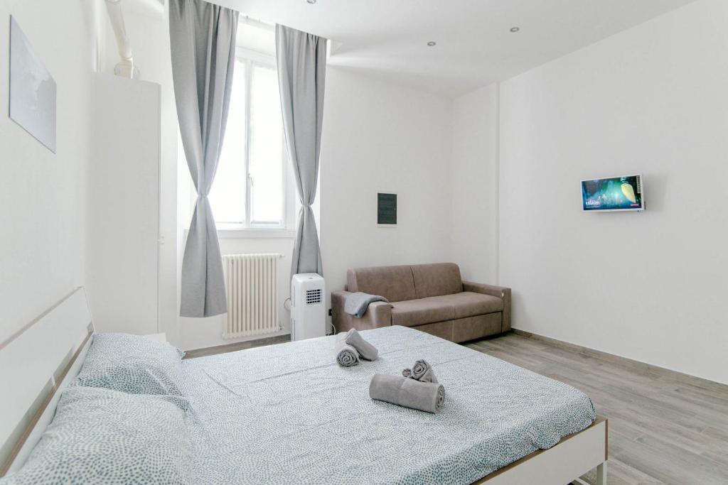 Postel nebo postele na pokoji v ubytování Downtown Rooms