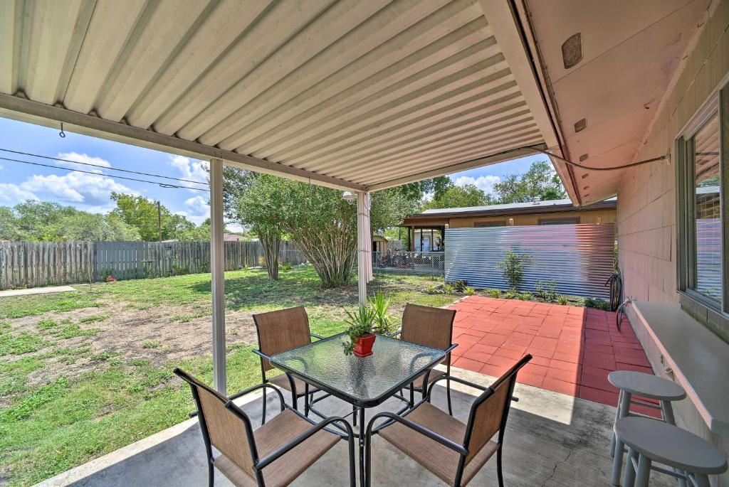 a patio with a table and chairs on a patio at Cozy San Antonio Family Home 3 Mi to Lackland AFB in San Antonio
