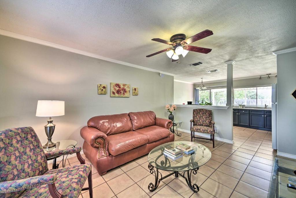 a living room with a couch and a ceiling fan at Cozy San Antonio Family Home 3 Mi to Lackland AFB in San Antonio