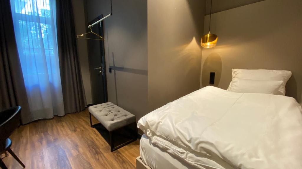 Postel nebo postele na pokoji v ubytování Munich Rooms Hotel