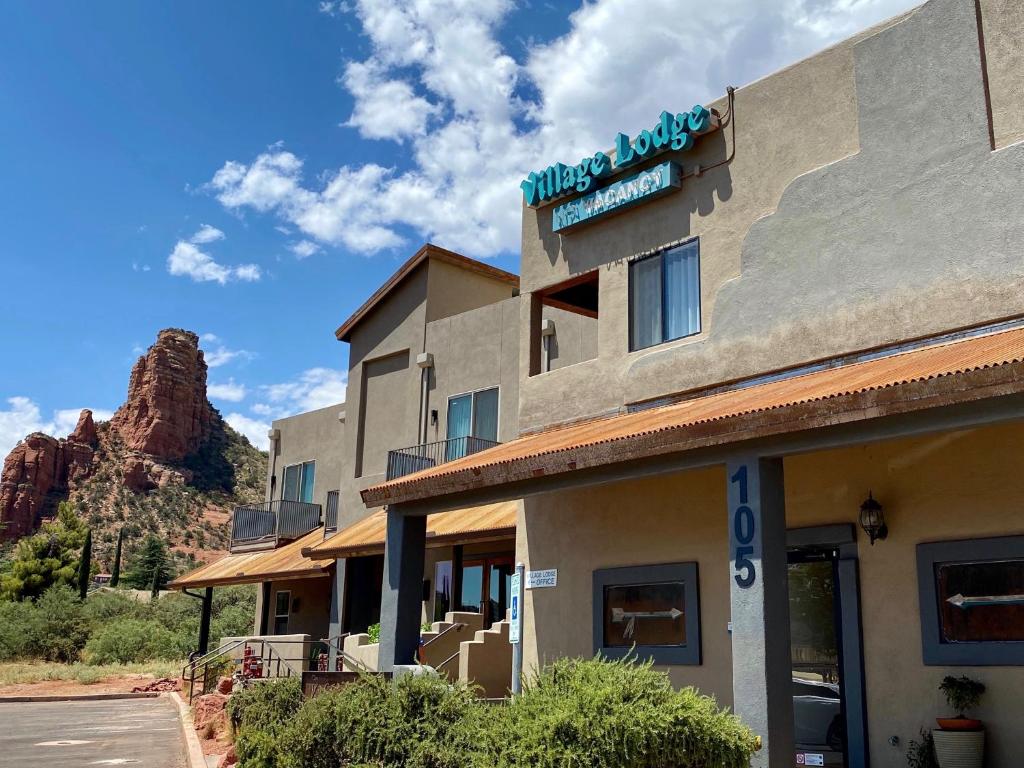 a building with a sign on the side of it at Sedona Village Lodge in Sedona