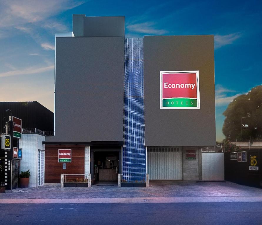 a building with a sign on the side of it at Economy Apart in Natal