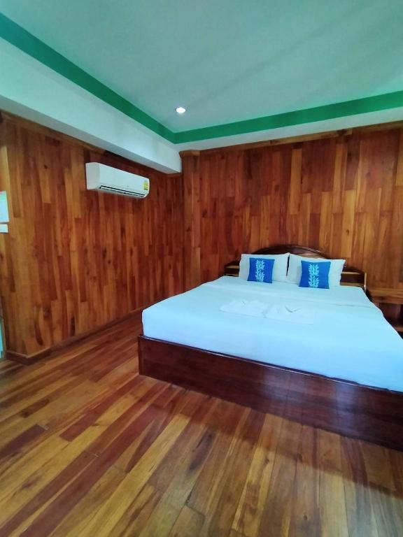 Postel nebo postele na pokoji v ubytování Palmsuay Resort