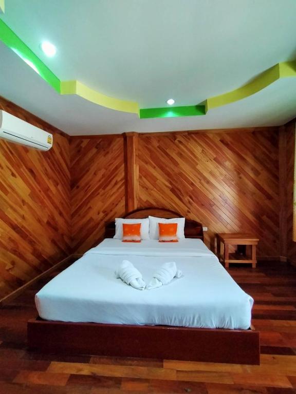 Postel nebo postele na pokoji v ubytování Palmsuay Resort