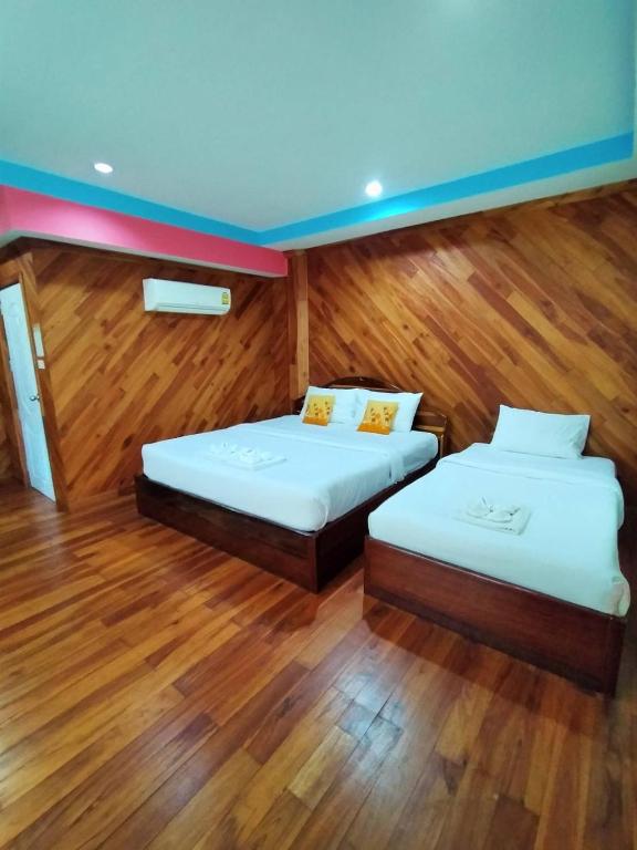 Postel nebo postele na pokoji v ubytování Palmsuay Resort