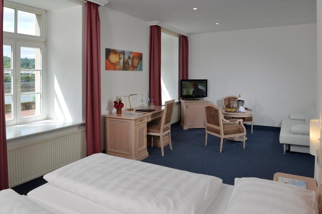 Postel nebo postele na pokoji v ubytování Hotel Stadt Hameln