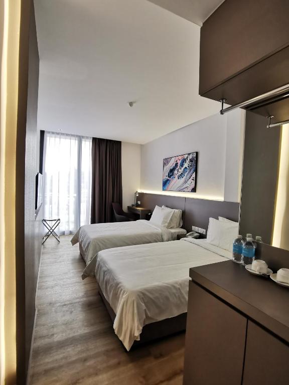 Postel nebo postele na pokoji v ubytování Otel Hotel Sibu