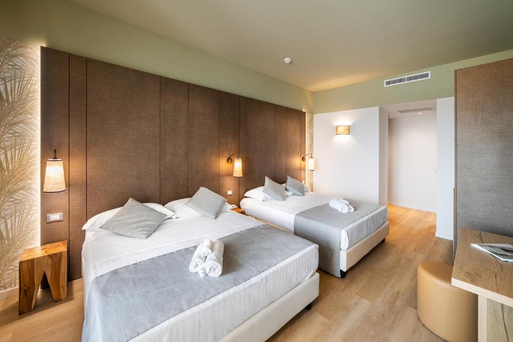 Postel nebo postele na pokoji v ubytování Hotel Life