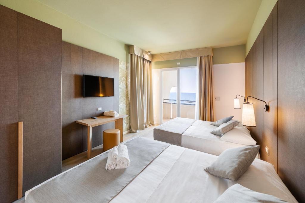 Postel nebo postele na pokoji v ubytování Hotel Life