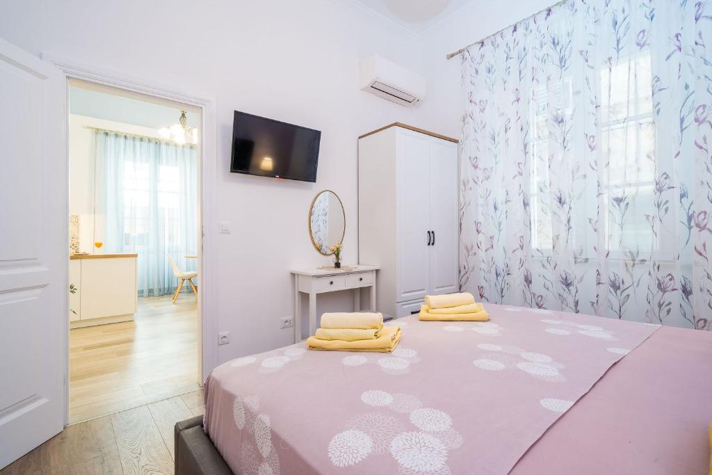 Posteľ alebo postele v izbe v ubytovaní Old Town Top Spot Apartments