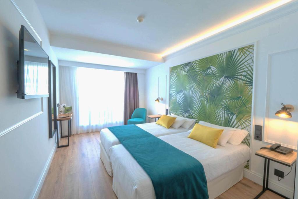 Postel nebo postele na pokoji v ubytování Hotel Acapulco