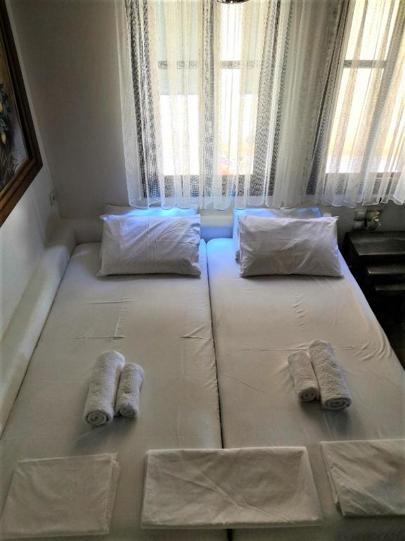 Postel nebo postele na pokoji v ubytování El Mar House Parga