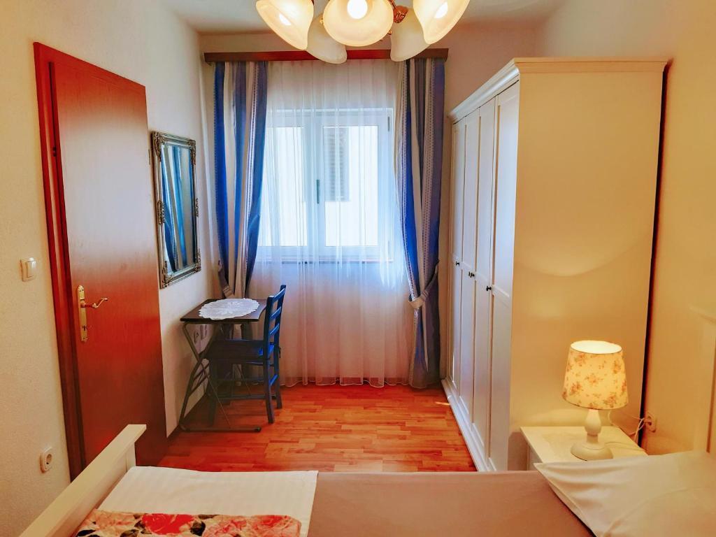 Postel nebo postele na pokoji v ubytování Apartments Vrisak