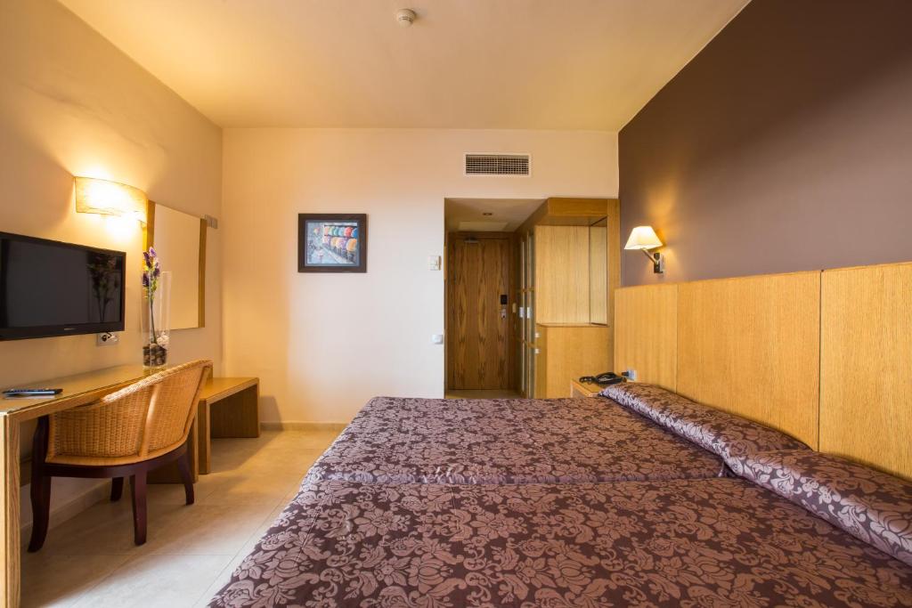 Televízia a/alebo spoločenská miestnosť v ubytovaní Hotel Alba Seleqtta