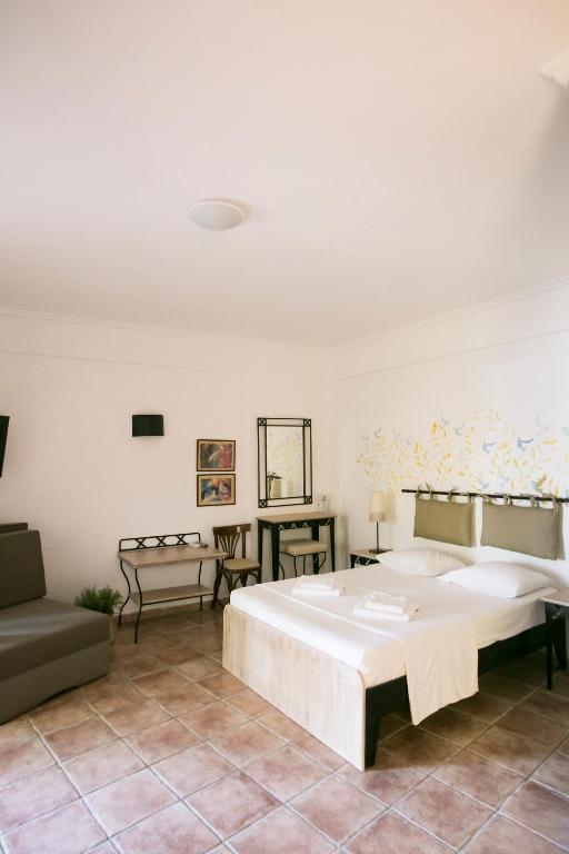 Posteľ alebo postele v izbe v ubytovaní Ammon Garden Hotel