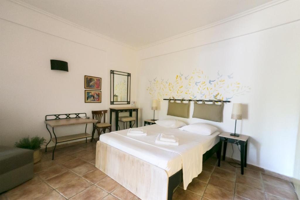 Posteľ alebo postele v izbe v ubytovaní Ammon Garden Hotel