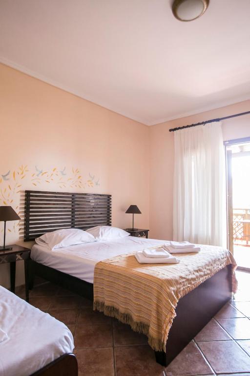 Posteľ alebo postele v izbe v ubytovaní Ammon Garden Hotel