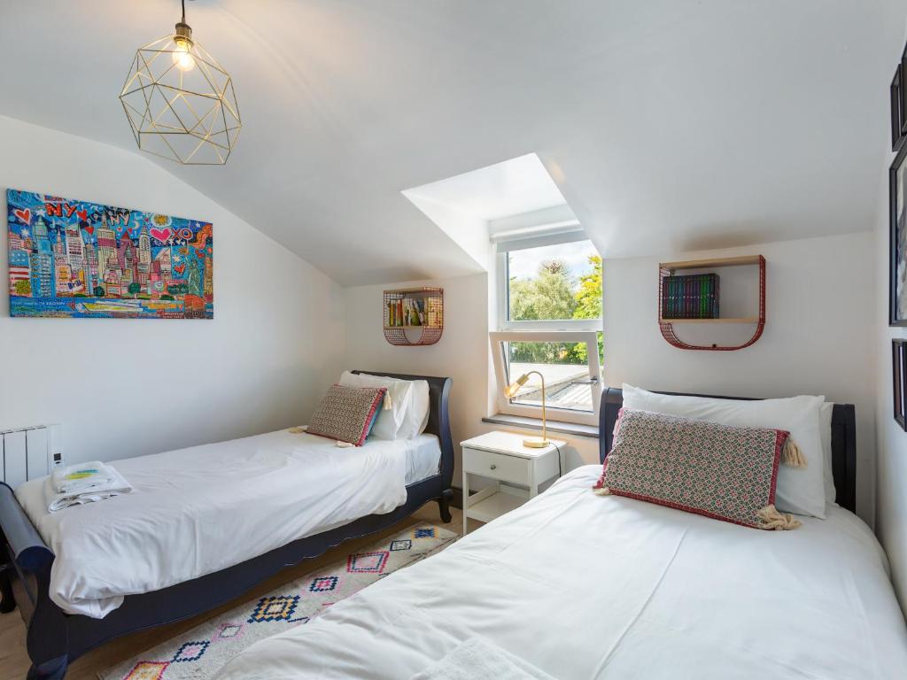 Postel nebo postele na pokoji v ubytování Macs Townhouse Dungarvan