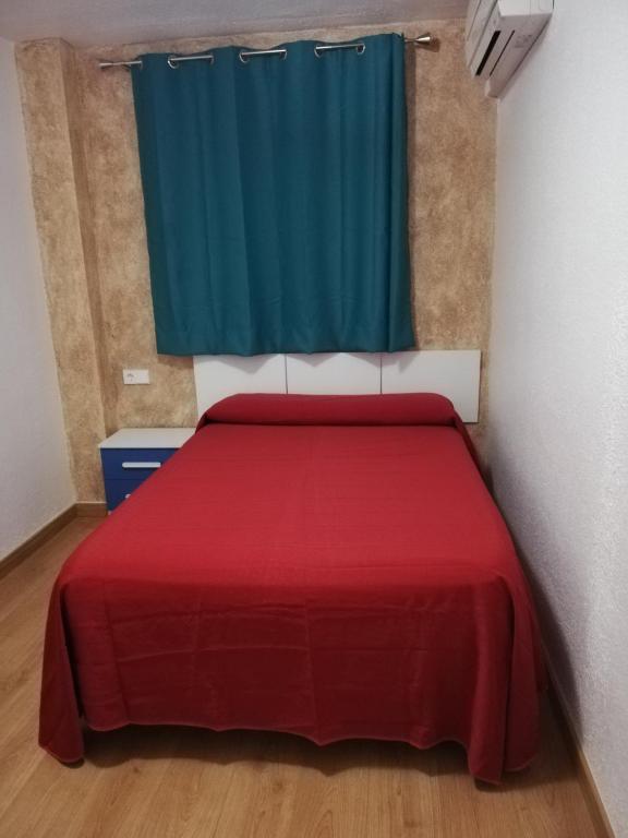 Postel nebo postele na pokoji v ubytování Hostal Rosa