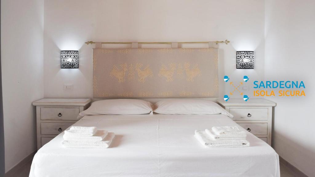 Postel nebo postele na pokoji v ubytování Corallo Rooms