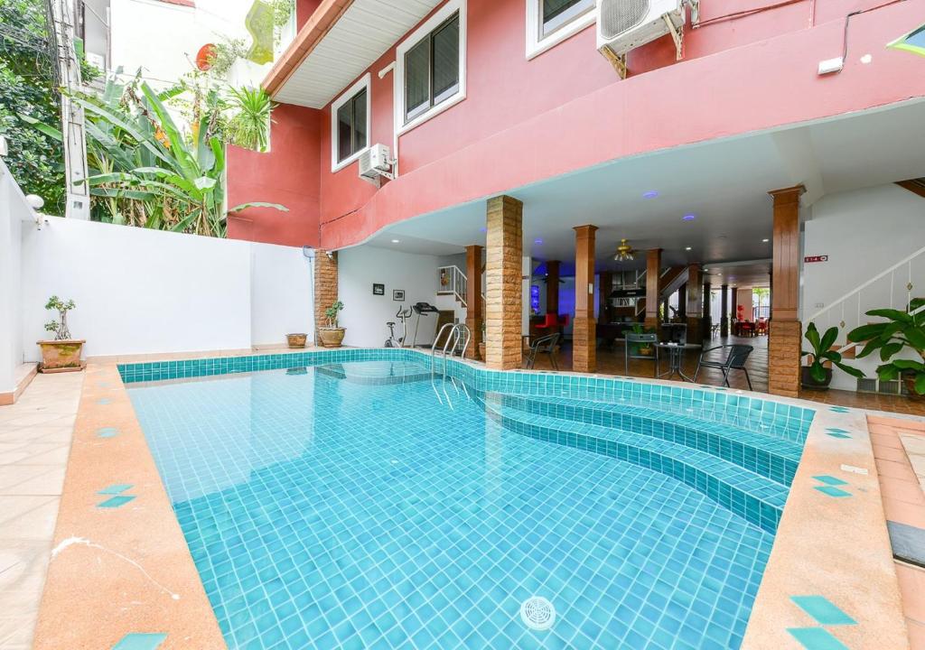 a swimming pool in the middle of a building at Sun & Beach in Pattaya South