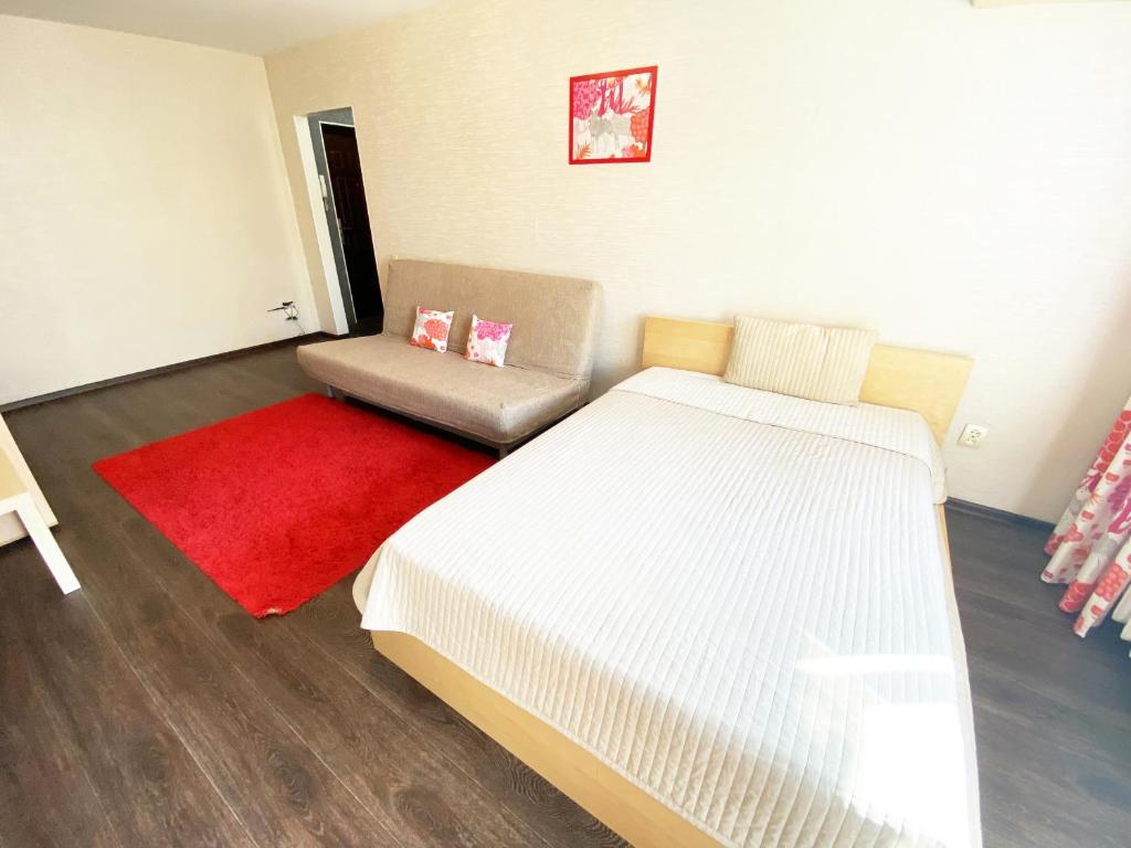 Кровать или кровати в номере Apartment Ibragimova 25