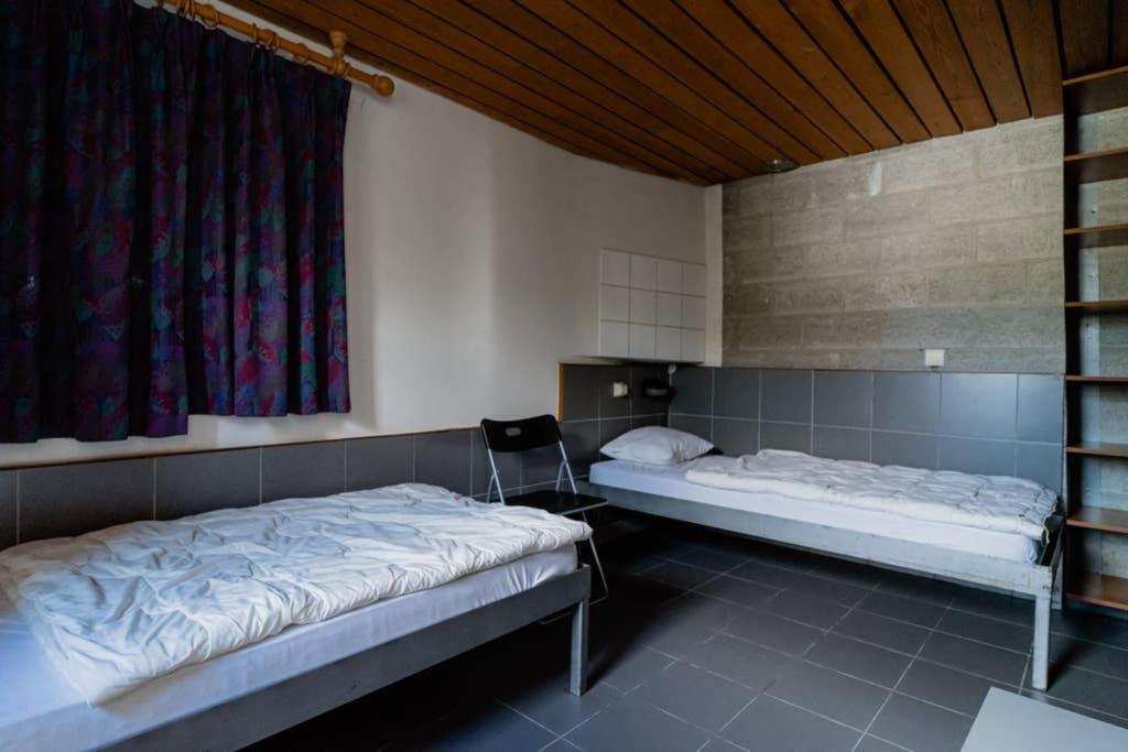 Postel nebo postele na pokoji v ubytování Rustig gelegen gîte nabij Houffalize