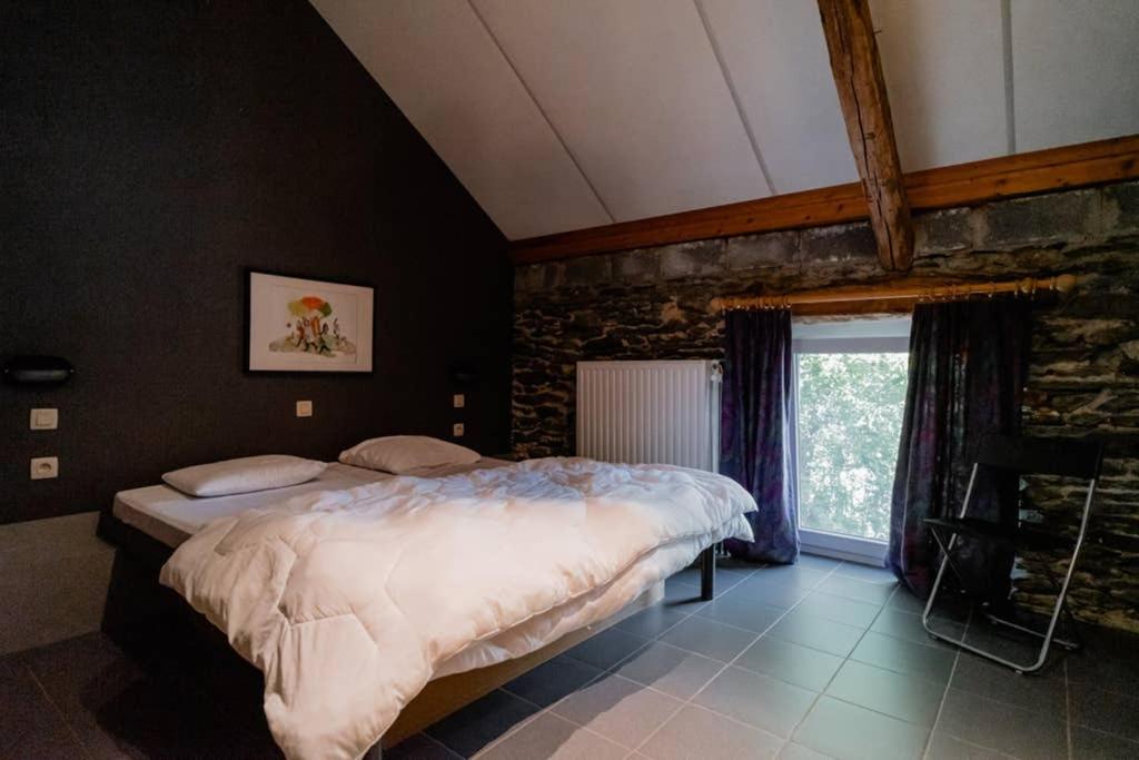 Postel nebo postele na pokoji v ubytování Rustig gelegen gîte nabij Houffalize
