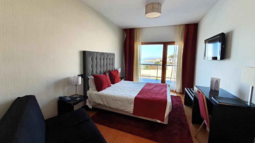 Een bed of bedden in een kamer bij Hotel Miramar Sul
