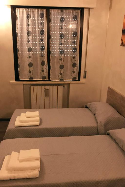 Postel nebo postele na pokoji v ubytování casa TRE19