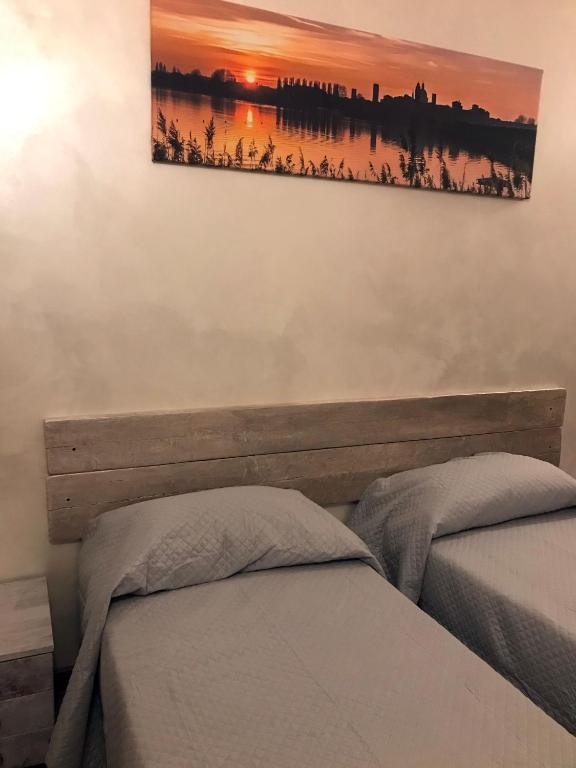 Postel nebo postele na pokoji v ubytování casa TRE19
