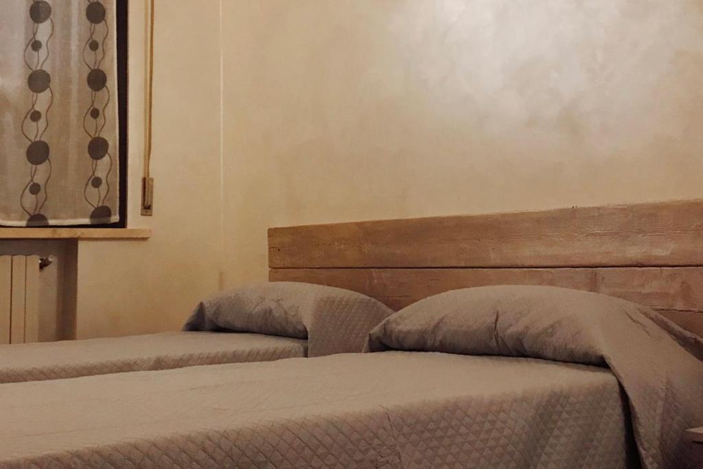 Postel nebo postele na pokoji v ubytování casa TRE19