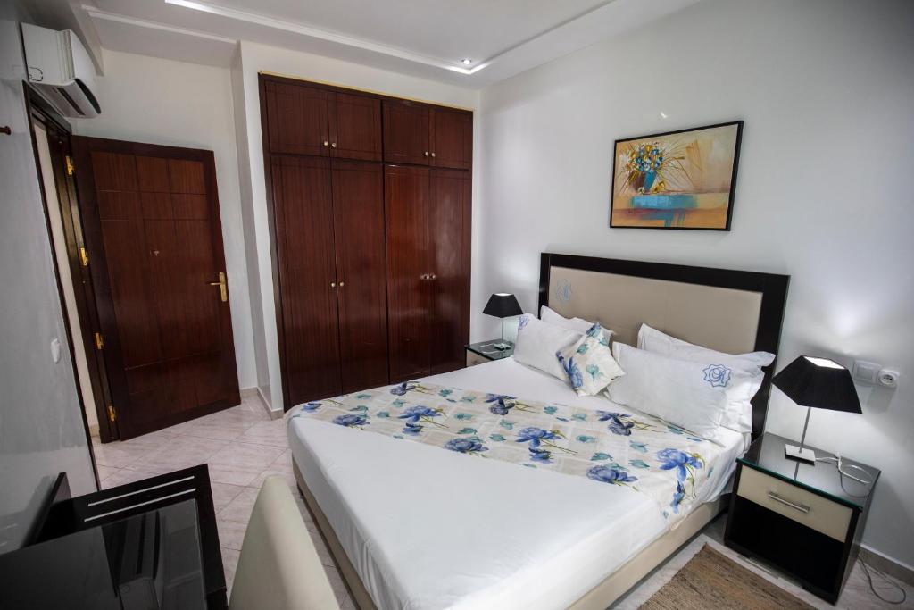 Una cama o camas en una habitación de Appart Hotel Rania