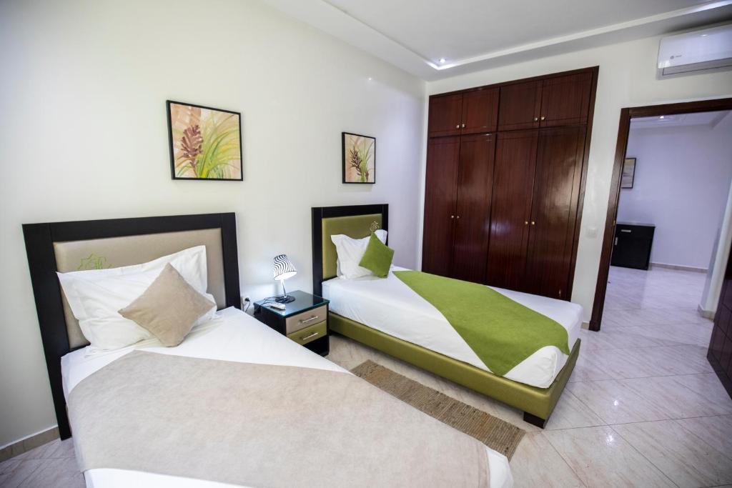 Una cama o camas en una habitación de Appart Hotel Rania