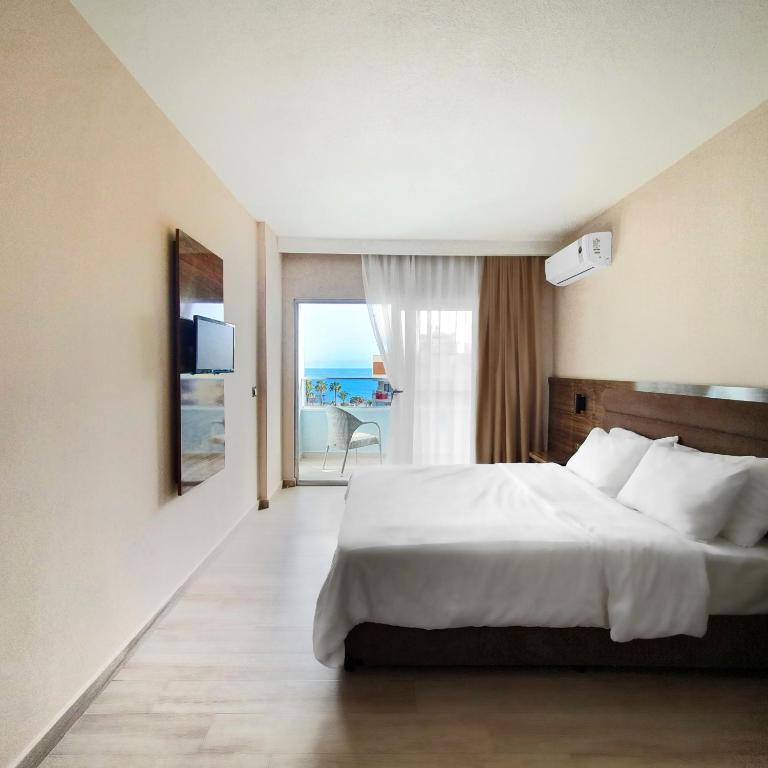 Postel nebo postele na pokoji v ubytování Ozgur Bey Spa Hotel
