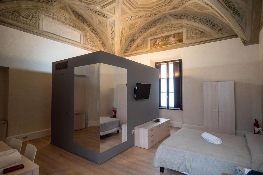 Posteľ alebo postele v izbe v ubytovaní Le Residenze di Mantova