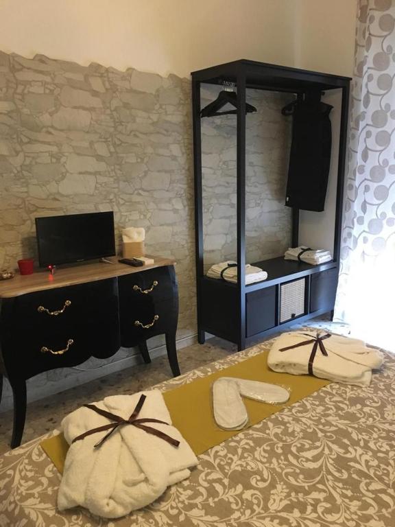 Posteľ alebo postele v izbe v ubytovaní Siracusa Vacanze